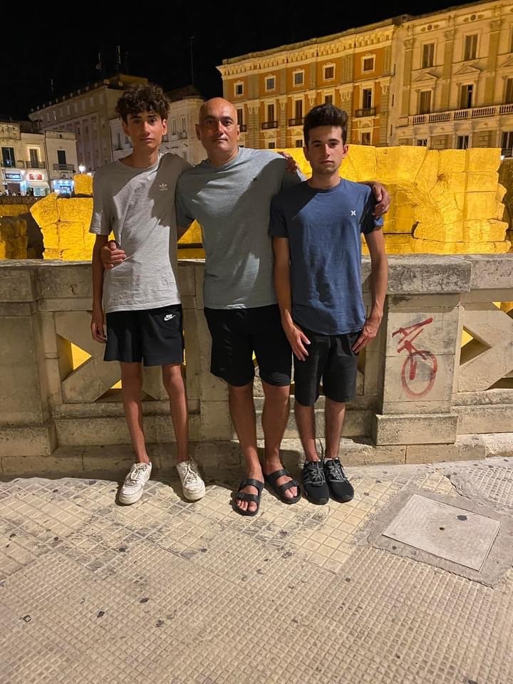 Francesco with his brother, Enzo, and father, Marco, in Lecce, Italie.